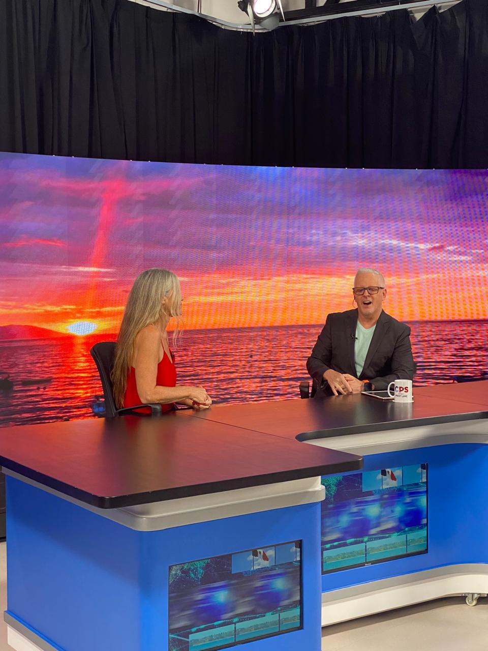 Melissa and Brent at CPS TV news desk - sponsor placement example